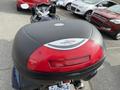 A 2016 Yamaha FJR1300AE motorcycle with a Kappa 48 top case installed on the rear end of the bike