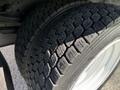 Close-up of a new tire on a 2019 Isuzu NQR showcasing its tread pattern and rubber texture