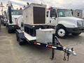 A 2005 Trailerman Generator Trailer featuring a Katolight generator on a dual axle trailer with a storage box and utility connections