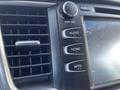 Close-up of the dashboard controls in a 2018 Toyota Highlander featuring the audio home and apps buttons along with a circular power volume knob