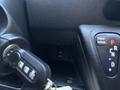 Interior dashboard view of a 2016 RAM Promaster showing the key ignition and a button labeled AUX along with a gear shift indicator