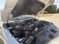 A 2017 Ford F-550 with its hood open showcasing the engine and components beneath