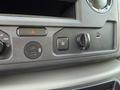 Interior control panel of a 2023 Ford E-450 featuring various buttons including a USB port and traction control switch