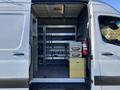 2024 Mercedes-Benz Sprinter 2500 with an open side door displaying a spacious interior featuring shelving storage compartments and equipment mounts