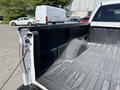 A 2014 Ford F-150 with an open truck bed showing its interior surface and side walls