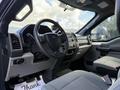 Interior view of a 2017 Ford F-550 featuring a steering wheel dashboard and seating with a modern design and controls