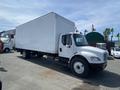 A white 2017 Freightliner M2 106 box truck parked with a large enclosed cargo area and dual rear wheels
