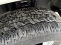 Close-up of a tread pattern on a tire from a 2015 Ford F-350 showing detailed grooves and texture designed for traction on various surfaces