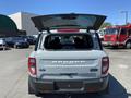 A 2023 Ford Bronco Sport with its rear hatch open showcasing the vehicle's interior and storage space