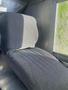 A gray and black upholstered driver's seat in a 2007 Morgan Olson Workhorse W42 with a textured pattern and slight contouring for comfort