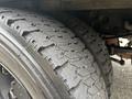 Close up of a set of tires on a 2010 Ford F-550 Super Duty showcasing the tread pattern and sidewall details
