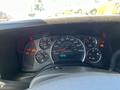 Dashboard of a 2013 Chevrolet Express showing speedometer fuel gauge and warning lights