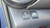 Dashboard controls of a 2019 Nissan Kicks featuring buttons for traction control off and an additional function
