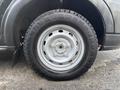 Close-up of a tire and wheel assembly from a 2018 Ford Transit-350 showing the tire tread and metal rim