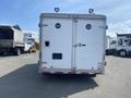 A white 2008 Wells Industries Inc EW1422 trailer with two doors and two mounted lights on top