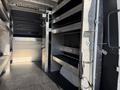 Interior view of a 2023 Mercedes-Benz Sprinter 2500 showing spacious shelving and storage compartments designed for utility and organization
