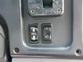 Close-up of the control panel in a 2011 Freightliner B2 featuring two buttons labeled Move Pedal and an unidentified symbol