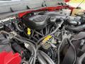 Engine compartment of a 2013 Ford F-550 with various hoses wires and components visible including an oil cap and coolant reservoir