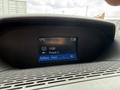 Dashboard display of a 2017 Ford Transit showing the time temperature and radio station preset