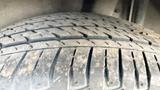 A close-up view of a textured tire tread from a 2019 Nissan Kicks showcasing the rubber patterns and wear on the tire surface