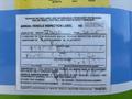 A 2011 Autocar Xpeditor vehicle inspection label with fields for the month and year completed and various identification details