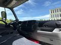 Interior view of a 2018 Hino 195 showing the dashboard steering wheel and seating area with modern controls and storage compartments