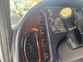 Interior view of a 2022 Freightliner M2 106 dashboard showing control buttons and instrument panel with gauges and a steering wheel