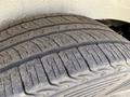 Close-up of a tire from a 2016 Mercedes-Benz Sprinter showing tread patterns with some dust and wear marks