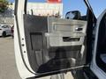 A 2016 RAM 5500 truck door is open showing the interior handle and panel details with dark and light colors