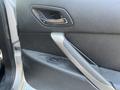 Close-up of the interior door handle and control buttons of a 2006 Pontiac G6