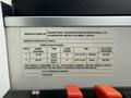 Label on a bus showing manufacturer details and specifications such as weight limits tire sizes and cold inflation pressure