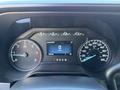 Dashboard of a 2024 Ford F-550 showing gauges for speedometer and fuel level with a digital display indicating speed and vehicle status