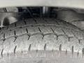Close-up of a treaded tire from a 2020 Ford Transit 250 showing detailed patterns and grooves designed for traction and stability
