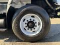 Close-up of a wheel from a 2013 International 7500 featuring a GoodYear tire with visible tread and a white metal rim