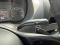 Interior view of a 2022 Mercedes-Benz Sprinter showcasing the gear shift lever and dashboard displays