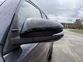 Close-up of the side mirror of a 2021 Toyota 4Runner showcasing its sleek design and black finish