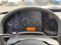 Dashboard of a 2011 International 4300 featuring multiple gauges for RPM speed fuel and warning indicators