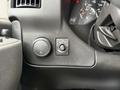 Dashboard controls of a 2023 GMC Savana including a knob for lighting and a button for the dome light