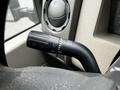 The image shows a close-up of the turn signal lever of a 2009 Ford F-550 featuring various indicator settings and a textured grip