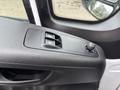 Interior door control panel of a 2023 RAM Promaster 3500 featuring window controls and a mirror adjustment knob