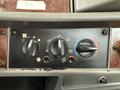 The image shows the control panel of a 2008 Kenworth T370 featuring knobs for climate control including temperature and airflow settings