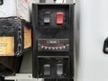 Control panel featuring switches for power and selector along with a gauge indicating positions for outriggers and their operational controls