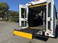 A 2017 Ford Transit-350 with a lowered ramp at the rear entrance and accessible features for passengers