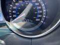 A close-up of the speedometer and odometer of a 2014 Hyundai Sonata showing a speed reading and an odometer reading of 5723 kilometers
