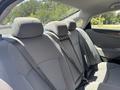 Gray fabric seats in the back row of a 2014 Hyundai Sonata with seat belts visible