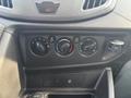 Control panel of a 2016 Ford Transit 150 featuring knobs for temperature control fan speed and air conditioning