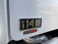 Close-up of a 2013 Freightliner 114SD badge showing the model number and the Allison Transmission label