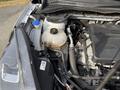 2020 Ford Escape engine bay with visible components including a yellow coolant reservoir and various hoses and wires