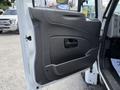The image shows the interior door panel of a 2014 International TerraStar featuring a smooth gray surface with a door handle and control panel