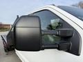 2020 Ford F-550 side mirror showing a black exterior finish with integrated turn signal and sturdy construction